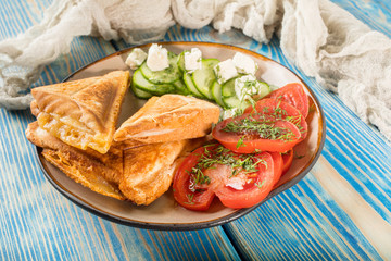 Sandwiches with cheese, tomatoes and cucumber.