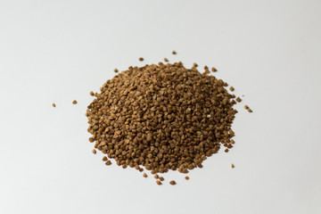 heap of buckwheat on a white background