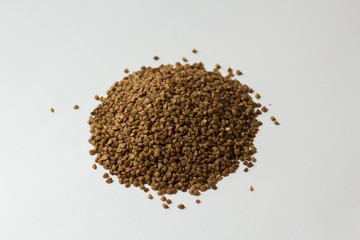 heap of buckwheat on a white background