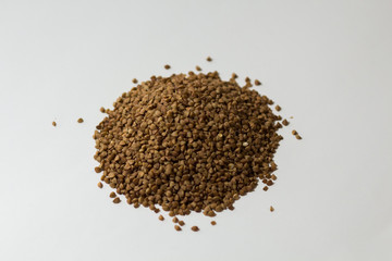 heap of buckwheat on a white background