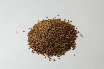 heap of buckwheat on a white background