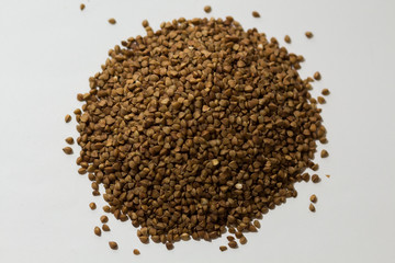 heap of buckwheat on a white background