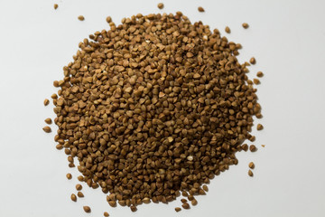 heap of buckwheat on a white background