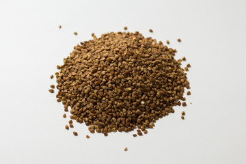 heap of buckwheat on a white background