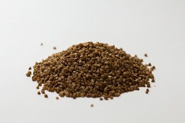 heap of buckwheat on a white background