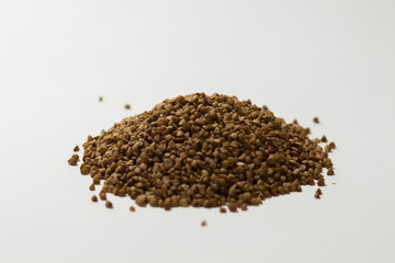 heap of buckwheat on a white background