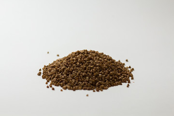 heap of buckwheat on a white background
