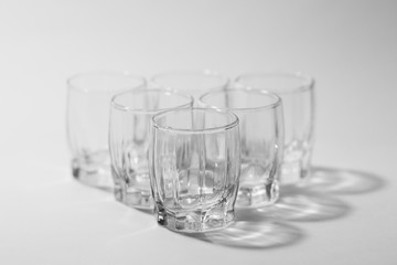 transparent small glasses on a white background