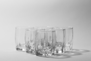 transparent small glasses on a white background
