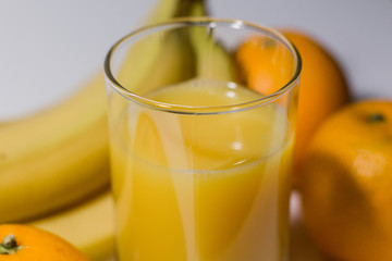 multivitamin juice near fruits