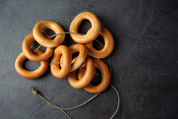 A bunch of baked bagels on a rope