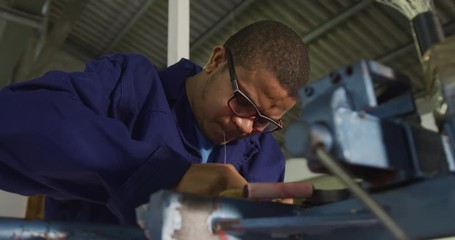 Mixed race man working in factory - Powered by Adobe