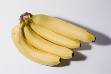ripe bananas on a white background