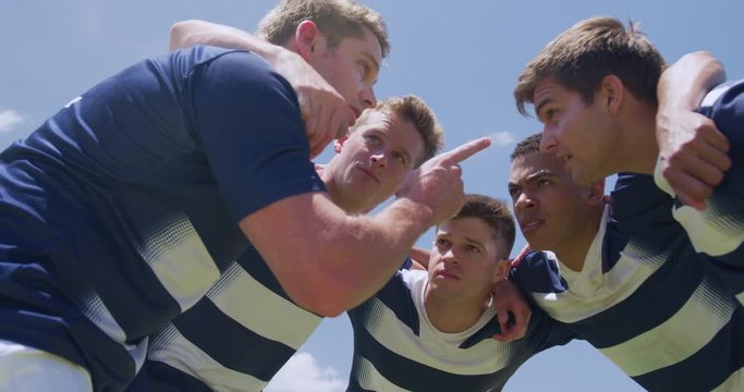 Rugby players motivating before match
