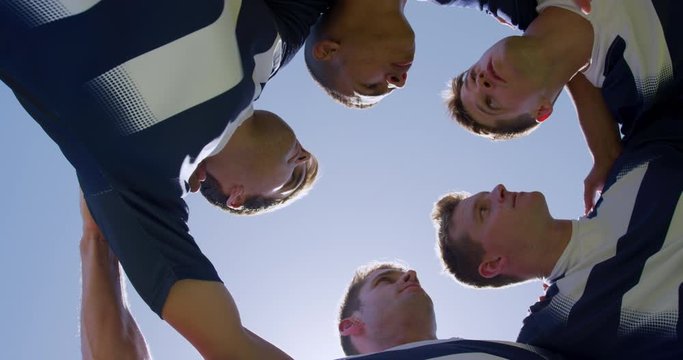 Rugby players motivating before match
