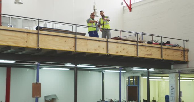 Workers discussing about the work