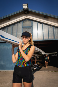 Female rowing team training on a river