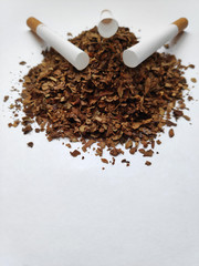 A bunch of tobacco. On a white paper.