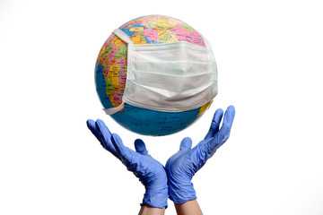 Save The World From The Coronavirus. Earth globe with a protective mask and hands, isolated on a white background. Human Epidemic Danger.