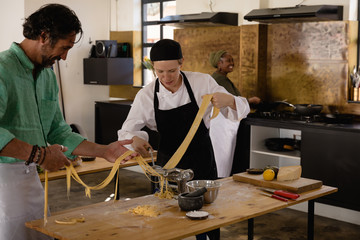 Chefs making pasta together