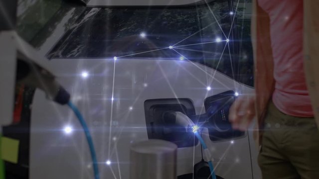 Man charging an electric car with network of connections moving