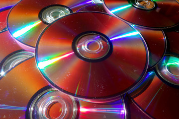 CD and DVD disks on table