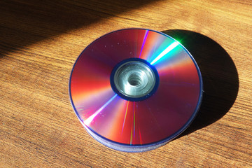 CD and DVD disks on table