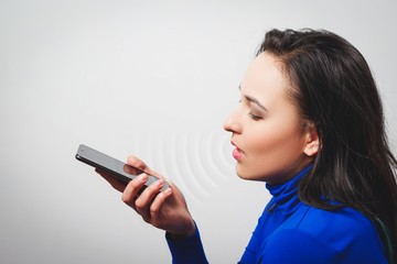 Women Using the voice recognition function, smart phones , Technology