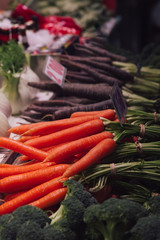 Stock photo of a bunch of orange carrots and black carrots