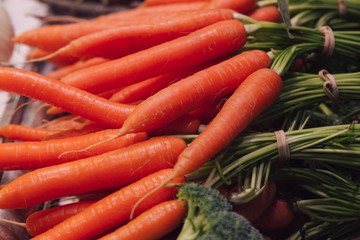 Stock photo of a close-up of a bunch of carrots at a market stall