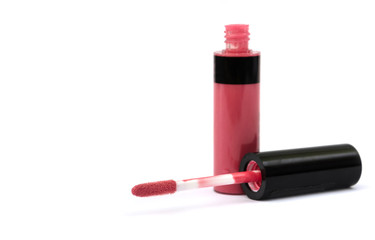 Obraz premium pink lip gloss on a white background. Place for text.