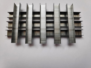 Iron staples. On a gray background.