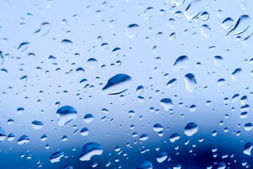 Large drops of water on the window glass_