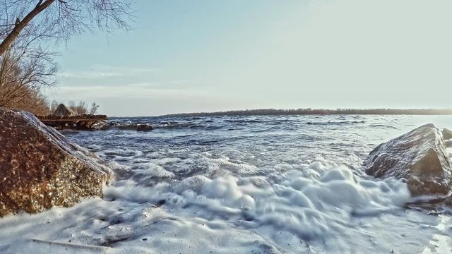landscape waves on the river a view of the stones and white foam in bright sunlight й 