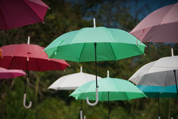 Perspective of colorful umbrella set in a park