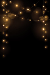 Fototapeta na wymiar Gold string lights on black background