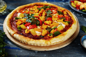 Close up of vegan colorful pizza on blue background