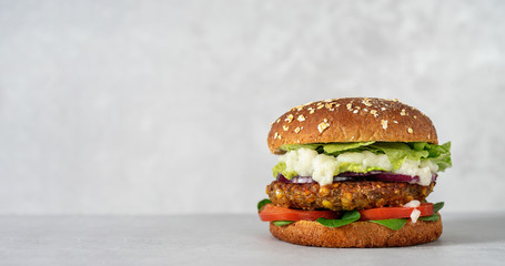 Vegan lentils burger with vegetables on light gray background - obrazy, fototapety, plakaty