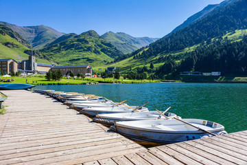 View of the jetty and the sanctuary in the background surrounded by mountains.