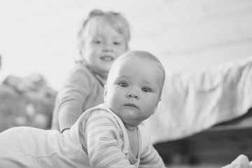 a child crawls on the floor in an apartment