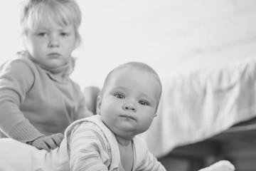 a child crawls on the floor in an apartment