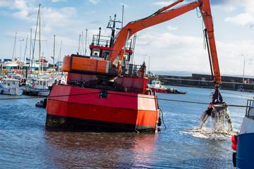 Dredger ship at work on the east coast of Scotland