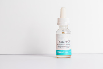 Tincture Oil Serene medical marijuana CBD and THC medicated oil on seamless white background 