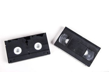 VHS video cassette isolated on white, retro video technology , analog magnetic tape 