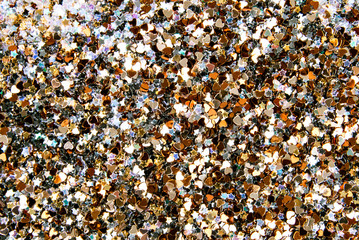 Confetti close up, various metallic  colors and shapes, horizontal background