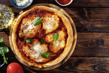 Close up of vegan pizza margherita with cauliflower creamy cheese