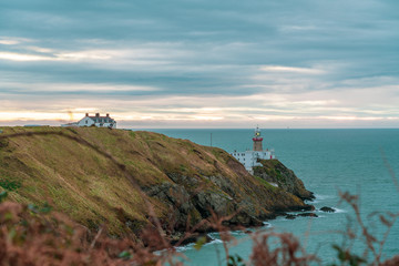 Fototapeta na wymiar View of Baily Lighthouse at sunrise.