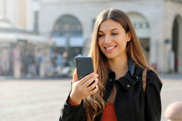 Video Call. Transfer student using phone for internet call in city street. Copy space.