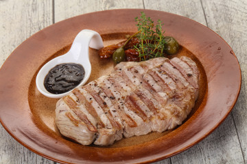 Grilled pork steak with pepper sauce