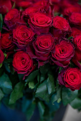 Beautiful bouquet of red roses made with love in the greek flowers boutique - preparation for Valentine's Day.